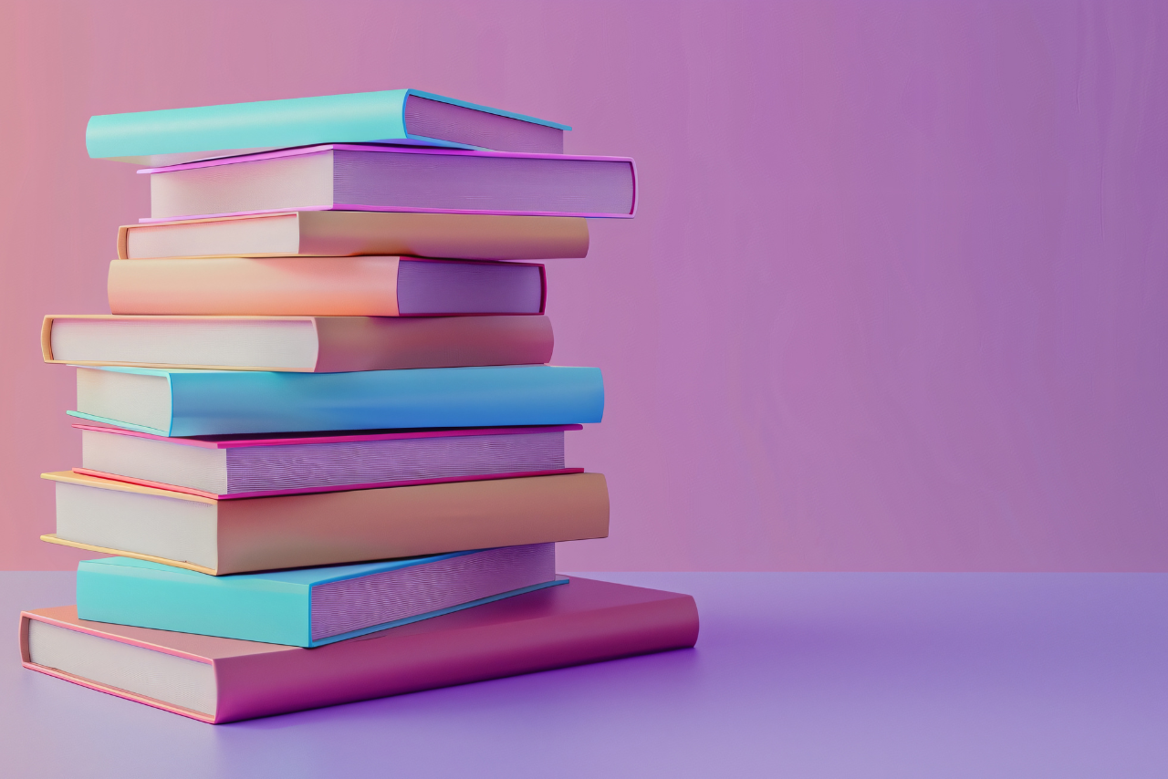 pile of books with a pink and purple background