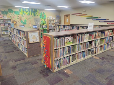 childrens area of library with books and computers